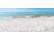 Expansive sandy beach with ocean waves gently rolling ashore at 18 N Casey Key Rd, Osprey, FL 34229