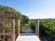 White wooden dock extends into calm waterway, surrounded by mangroves at 18 N Casey Key Rd, Osprey, FL 34229
