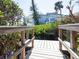 Wooden walkway over water leads to the property and beyond at 18 N Casey Key Rd, Osprey, FL 34229