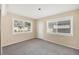 Bright bedroom with gray carpet and exterior access at 1815 Vera Pl # 9, Sarasota, FL 34235