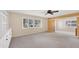 Spacious bedroom with grey carpet, built-in shelving, and sliding glass doors at 1815 Vera Pl # 9, Sarasota, FL 34235