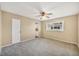 Bright bedroom with grey carpet and ceiling fan at 1815 Vera Pl # 9, Sarasota, FL 34235