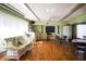 Community room with comfortable seating and large windows at 1815 Vera Pl # 9, Sarasota, FL 34235