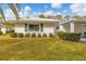 Single story home with green landscaping and carport at 1815 Vera Pl # 9, Sarasota, FL 34235
