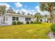 Building exterior with well-maintained lawn and landscaping at 1815 Vera Pl # 9, Sarasota, FL 34235