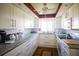 Well-equipped kitchen with granite countertops and white cabinets at 1815 Vera Pl # 9, Sarasota, FL 34235