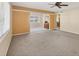 Spacious living area with open floor plan and ceiling fan at 1815 Vera Pl # 9, Sarasota, FL 34235