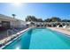 Sparkling community pool with plenty of lounge chairs at 1815 Vera Pl # 9, Sarasota, FL 34235