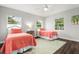 Bedroom with twin beds and plenty of natural light at 2202 Hyde Park St, Sarasota, FL 34239
