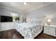 Spacious primary bedroom with king-size bed and en-suite bathroom at 2202 Hyde Park St, Sarasota, FL 34239