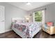 Bright bedroom with queen-size bed and comfy armchair at 2202 Hyde Park St, Sarasota, FL 34239