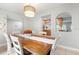 Spacious dining area with wooden table and kitchen view at 2202 Hyde Park St, Sarasota, FL 34239