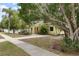 Charming yellow house with a spacious yard and mature landscaping at 2202 Hyde Park St, Sarasota, FL 34239