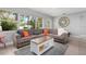 Bright living room with sectional sofa and large window at 2202 Hyde Park St, Sarasota, FL 34239