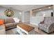 Living room featuring comfortable seating and a view of the kitchen at 2202 Hyde Park St, Sarasota, FL 34239