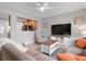 Cozy living room with sectional sofa and large TV at 2202 Hyde Park St, Sarasota, FL 34239