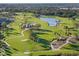 Aerial perspective of the golf course layout and landscape at 26720 Weiskopf Dr, Englewood, FL 34223