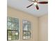 Bedroom with two windows and ceiling fan at 26720 Weiskopf Dr, Englewood, FL 34223