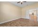 Bedroom with tile floors and view into kitchen at 26720 Weiskopf Dr, Englewood, FL 34223