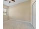 Bright bedroom with window, ceiling fan and neutral wall paint at 26720 Weiskopf Dr, Englewood, FL 34223