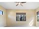 Bright bedroom with carpet flooring, ceiling fan, and window at 26720 Weiskopf Dr, Englewood, FL 34223