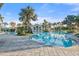 Large community pool with surrounding lounge chairs at 26720 Weiskopf Dr, Englewood, FL 34223