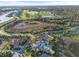 Aerial view of community pool and clubhouse at 26720 Weiskopf Dr, Englewood, FL 34223