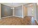 Elegant dining room with tile floors and gray accent wall at 26720 Weiskopf Dr, Englewood, FL 34223