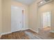 Bright entryway with tile floors and neutral walls at 26720 Weiskopf Dr, Englewood, FL 34223