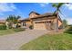 House exterior with landscaping, driveway and tile roof at 26720 Weiskopf Dr, Englewood, FL 34223