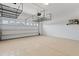 Garage with overhead storage and neutral colored floor at 26720 Weiskopf Dr, Englewood, FL 34223