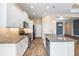 Sleek kitchen design with stainless steel appliances and white cabinetry at 26720 Weiskopf Dr, Englewood, FL 34223