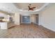 Open living room showcasing a spacious layout with tile flooring and neutral color palette at 26720 Weiskopf Dr, Englewood, FL 34223
