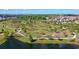 Aerial view of community featuring a scenic park, walking trails, and a pond at 3314 Chestertown Loop, Bradenton, FL 34211