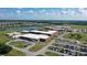 Aerial view of a school with large parking lots and playground at 3314 Chestertown Loop, Bradenton, FL 34211