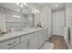 Double vanity bathroom with a large mirror and modern finishes at 3314 Chestertown Loop, Bradenton, FL 34211