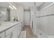 Elegant bathroom with double vanity and walk-in shower at 3314 Chestertown Loop, Bradenton, FL 34211
