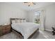 King-size bed in a spacious bedroom with large window at 3314 Chestertown Loop, Bradenton, FL 34211