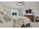 Bright bedroom featuring a king-size bed and mounted TV at 3314 Chestertown Loop, Bradenton, FL 34211