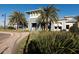 Community clubhouse with palm trees and a welcoming entrance at 3314 Chestertown Loop, Bradenton, FL 34211