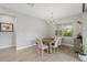 Bright dining room with wooden table and chandelier at 3314 Chestertown Loop, Bradenton, FL 34211