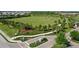 Community entrance with landscaping and park view at 3314 Chestertown Loop, Bradenton, FL 34211