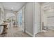 Bright and spacious entryway with tile floors and access to bathroom at 3314 Chestertown Loop, Bradenton, FL 34211