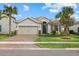 Single-story house with a two car garage and a well manicured lawn at 3314 Chestertown Loop, Bradenton, FL 34211