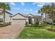 Single story home with a two car garage and beautiful landscaping at 3314 Chestertown Loop, Bradenton, FL 34211