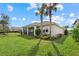 House exterior with a large backyard and palm trees at 3314 Chestertown Loop, Bradenton, FL 34211