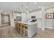 Modern kitchen with large island, stainless steel appliances, and white cabinetry at 3314 Chestertown Loop, Bradenton, FL 34211