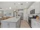 Open concept kitchen with large island and granite countertops at 3314 Chestertown Loop, Bradenton, FL 34211