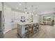 Open concept kitchen with granite countertops and gray island at 3314 Chestertown Loop, Bradenton, FL 34211