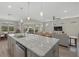 Open concept kitchen with large island and granite countertops at 3314 Chestertown Loop, Bradenton, FL 34211